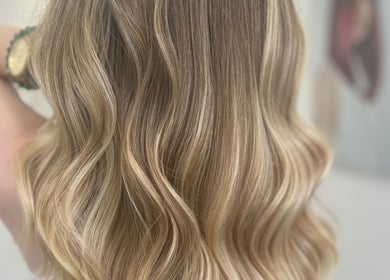 Elegant blonde waves styled by hairbyelliemay in Royal Tunbridge Wells, England, GB salon.