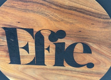 Efie Beauty & Aesthetics logo on a wooden background in Cannock, England, GB.