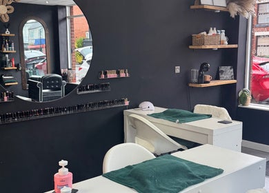 Modern nail station at Efie Beauty & Aesthetics, Cannock, England, GB. Elegant mirrors and well-stocked shelves.