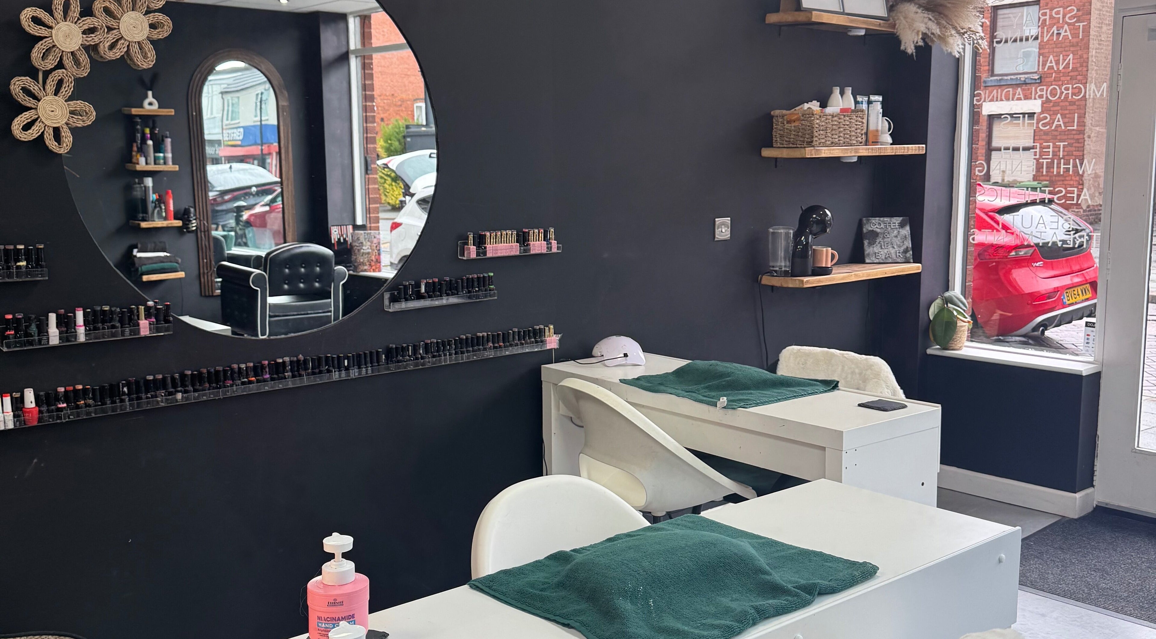 Modern nail salon station at Efie Beauty & Aesthetics, Cannock, England, GB, featuring sleek decor and nail polish display.