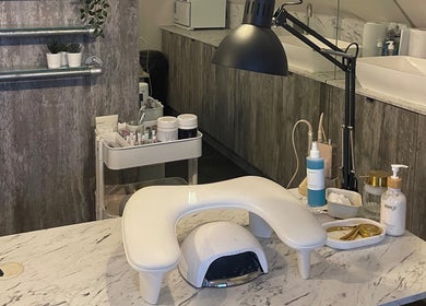 Modern nail station at By Sam - Nail Artist in Edinburgh, Scotland, GB, featuring tools and products.