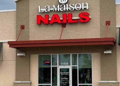 Front entrance of 813 Nail Collective in Riverview, Florida, US, with bold red signage.