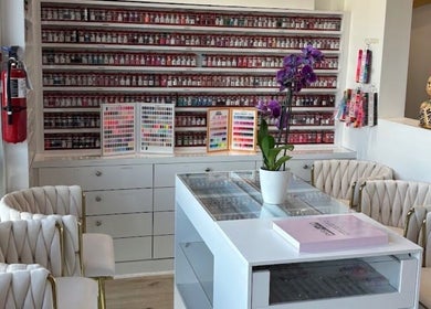Chic interior of 813 Nail Collective with vibrant polishes, Riverview, Florida, US.