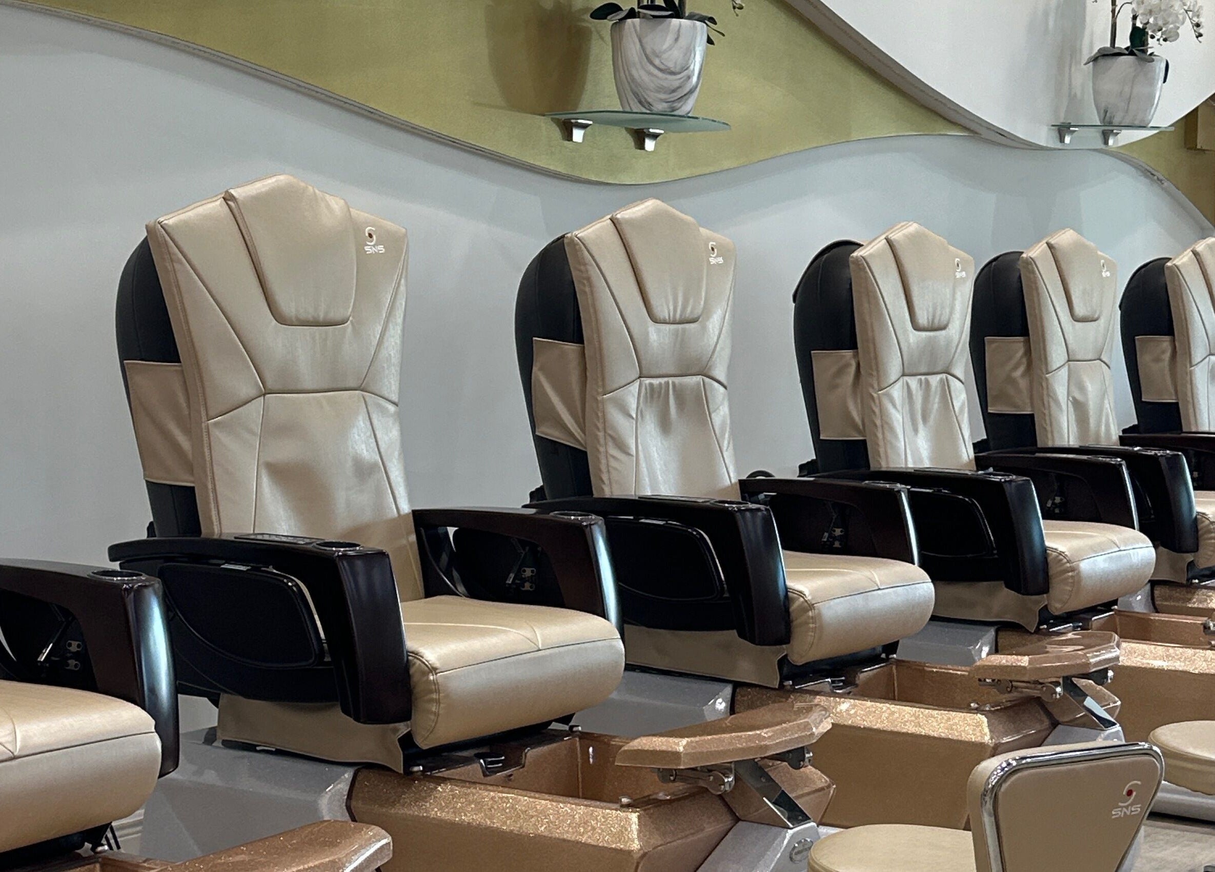 Elegant pedicure chairs at 813 Nail Collective in Riverview, Florida, US, offering premium relaxation.
