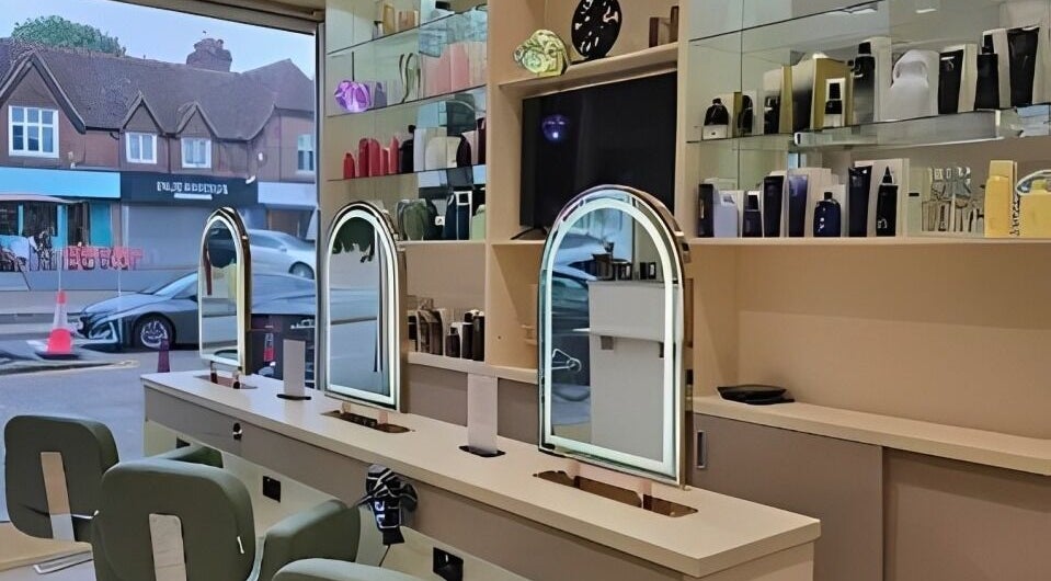 Stylish vanity stations inside Loca Blow Bar, Radlett, England, GB, featuring elegant decor and modern design.