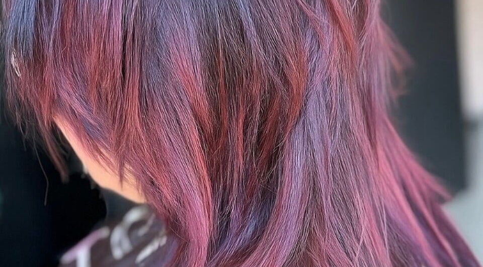 Vibrant purple hair styled at Hair by Jodie at Efie, Cannock, England, GB.