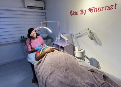 Aesthetic treatment at SkinByGharnet in Lagos, Lagos, NG, featuring a facial session with a professional therapist.