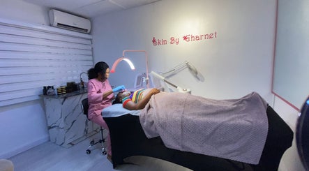 Aesthetician at SkinByGharnet in Lagos, Lagos, NG, performing a soothing facial treatment.