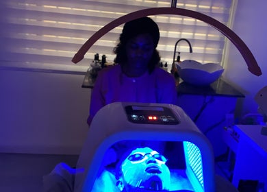 Facial treatment in progress under blue light therapy at SkinByGharnet, Lagos, Lagos, NG.