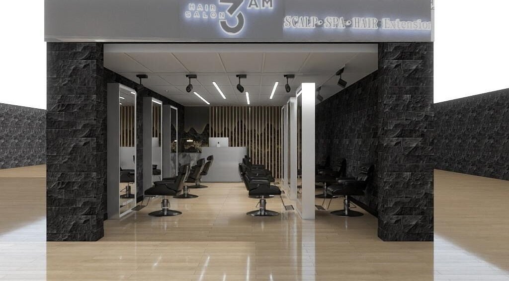 Sleek interior view of 3AM Salon in Singapore, SG, with modern, chic styling stations and mirrors.