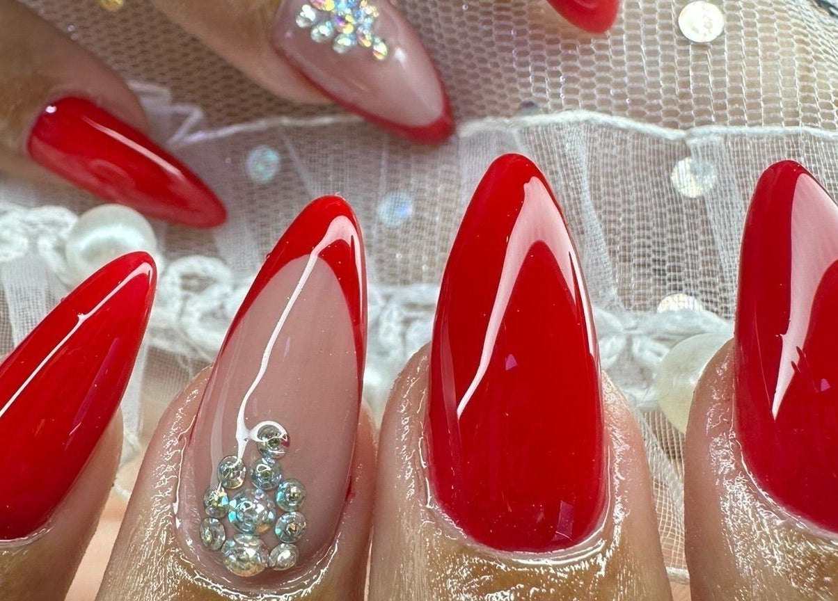 Elegant red nails with rhinestones at The Rich Brave Studio, Willemstad, Curaçao, CW.