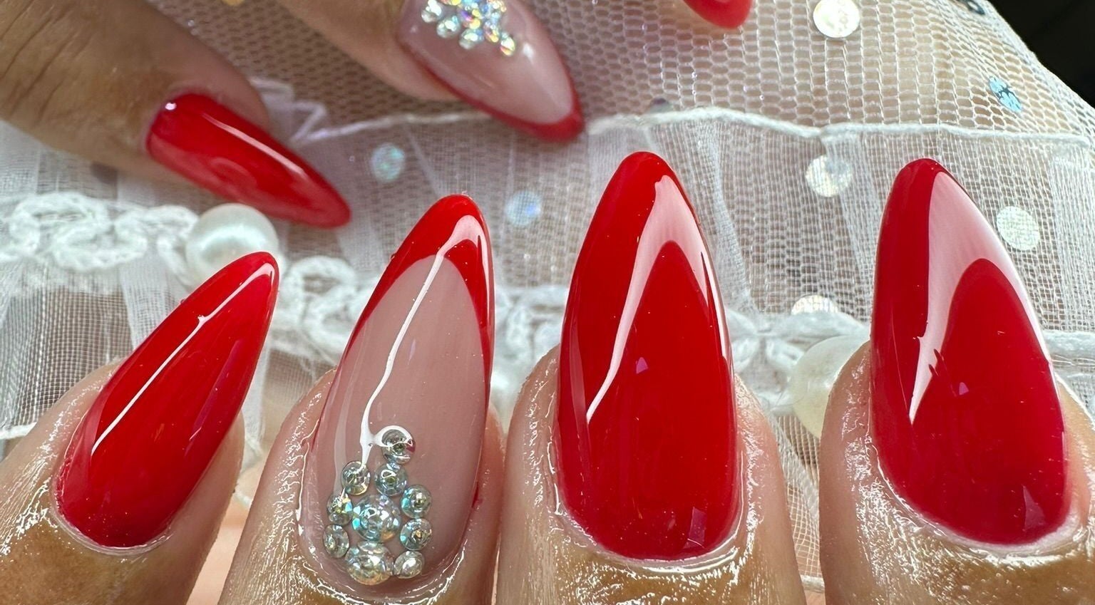 Elegant red nails with rhinestones at The Rich Brave Studio, Willemstad, Curaçao, CW.