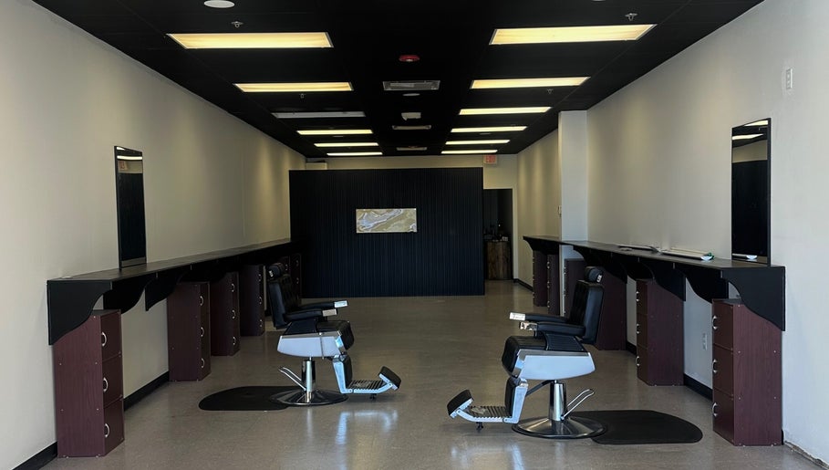 Modern interior of Upperroom Barbershop in Russellville, Arkansas, US with stylish barber chairs.