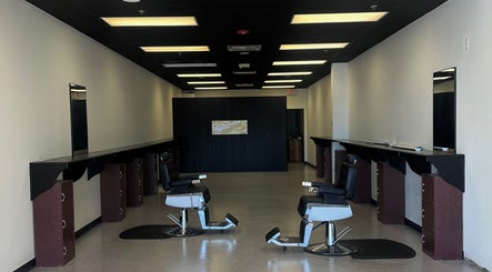 Modern interior of Upperroom Barbershop in Russellville, Arkansas, US with stylish barber chairs.