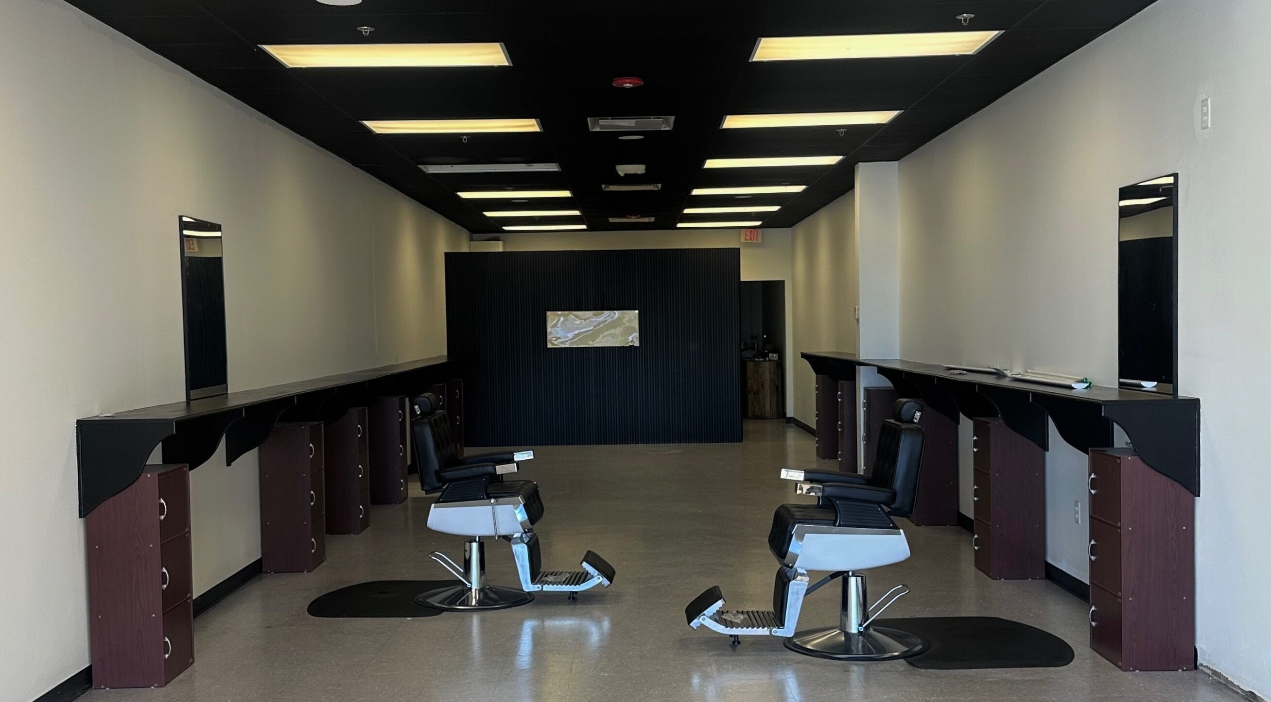Modern interior of Upperroom Barbershop in Russellville, Arkansas, US with stylish barber chairs.