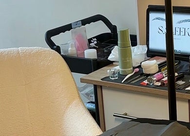 Beauty station at S.Sleek in Bolton, England, GB, showcasing tools and a cozy chair for treatments.