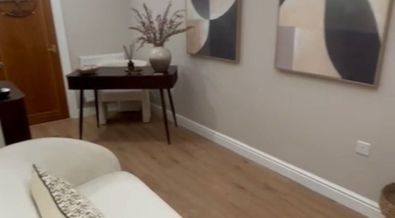 Contemporary decor at Mia's Beauty Room in Poole, England, GB. Elegant table and abstract wall art.