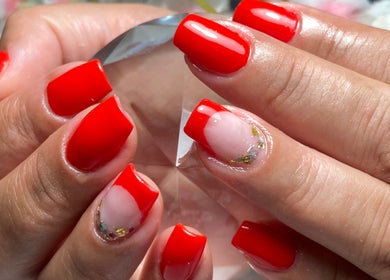 Vibrant red manicure at Michelli Santana Cabeleireiro e Estética, Lisboa, Lisboa, PT.