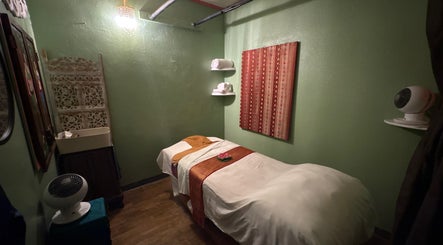 Relaxing massage room at Thai Style Massage in San Diego, California, US with earthy decor and soft lighting.