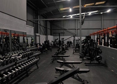 Modern gym at MK Coaching in Halfway, England, GB, featuring state-of-the-art equipment and spacious layout.