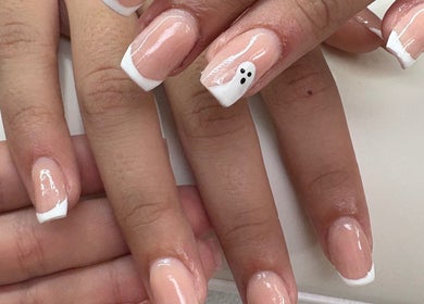 Stylish nail art with French tips at Createdbycarris in Lytham Saint Annes, England, GB; elegant and creative design.