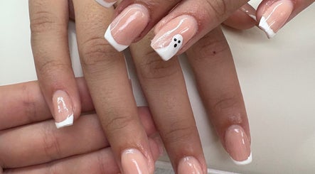 Stylish nail art with French tips at Createdbycarris in Lytham Saint Annes, England, GB; elegant and creative design.