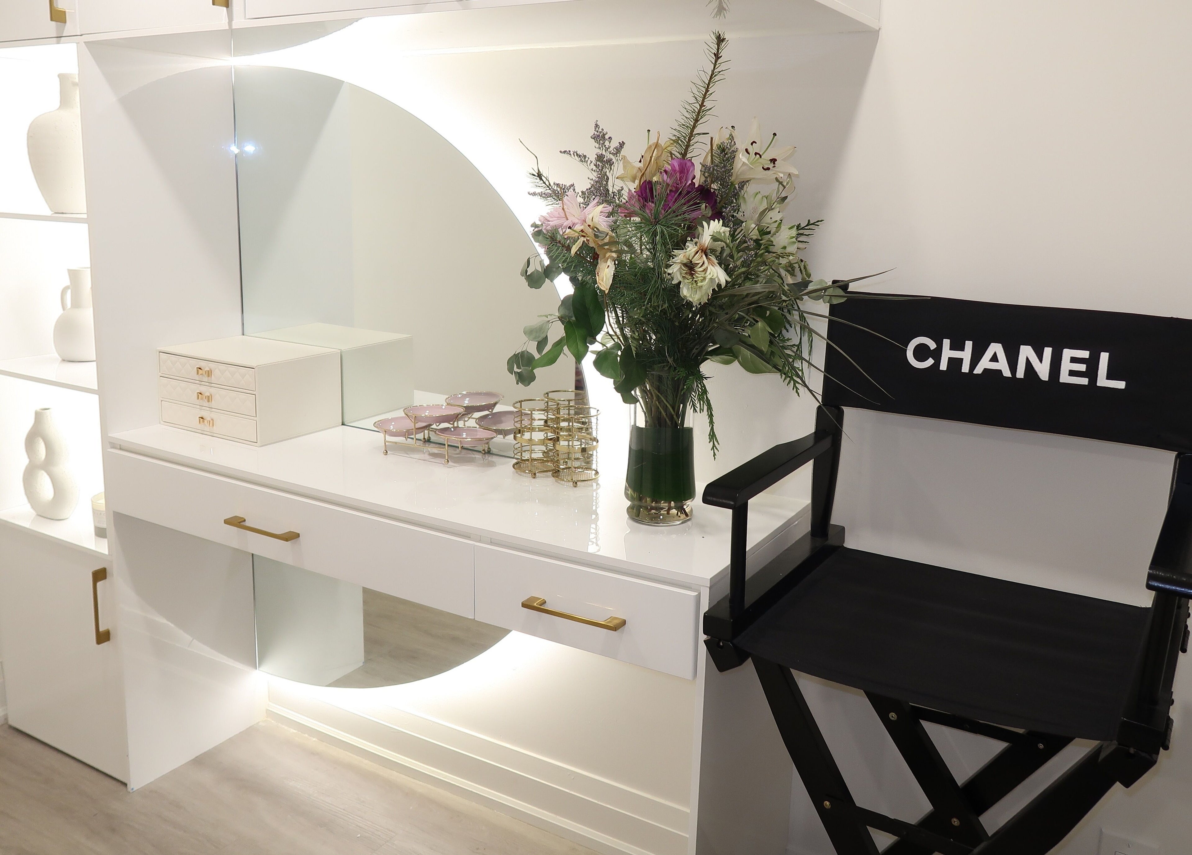 Elegant vanity with flowers at Maison Belissy Beauty Salon x Nail Salon, Toronto, Ontario, CA.