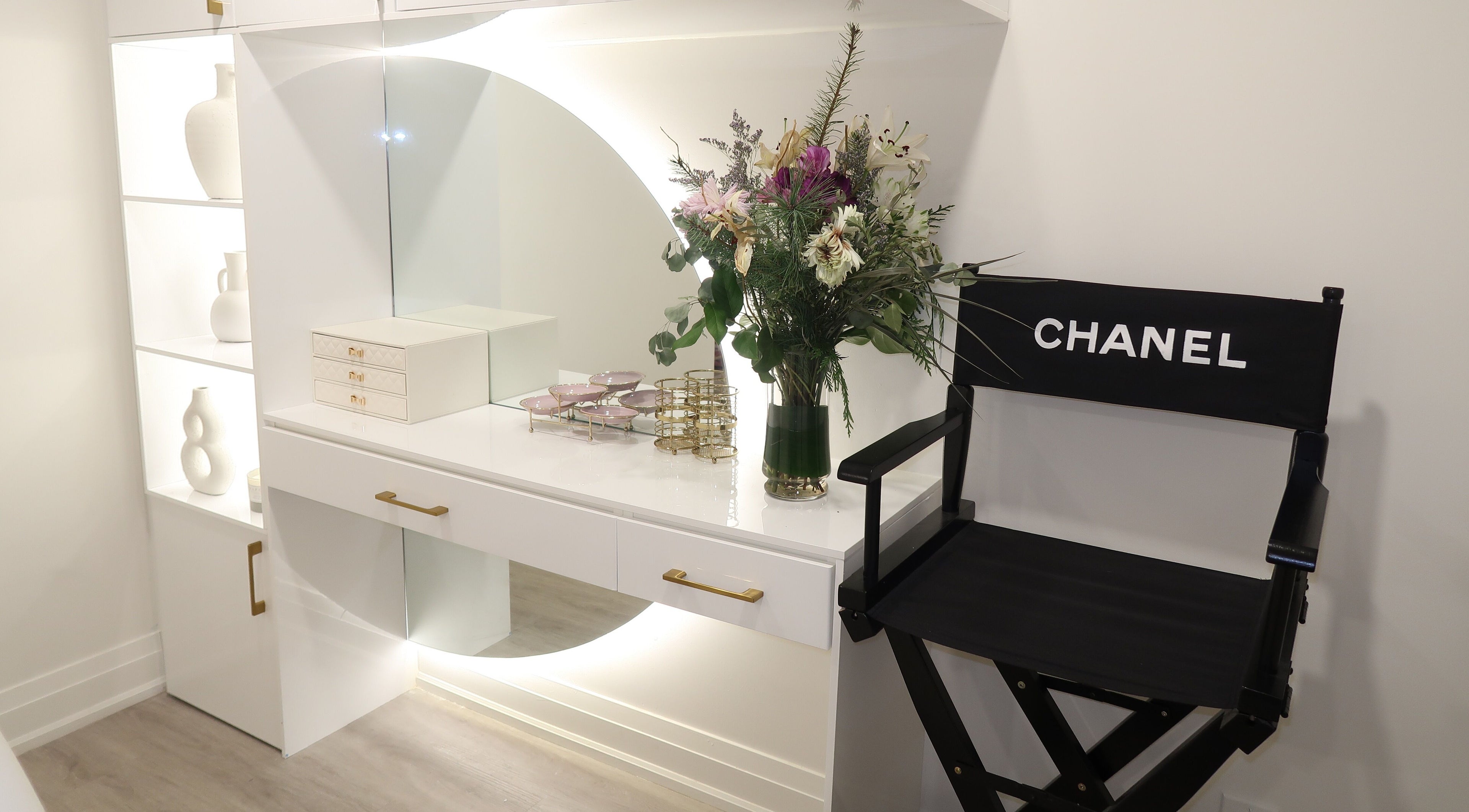 Elegant vanity with flowers at Maison Belissy Beauty Salon x Nail Salon, Toronto, Ontario, CA.