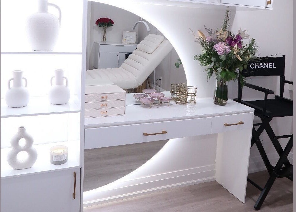 Chic interior of Maison Belissy Beauty Salon x Nail Salon, Toronto, Ontario, CA with decor and a cozy chair.