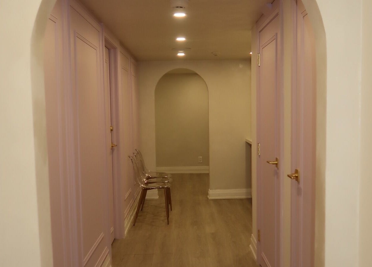 Elegant corridor at Maison Belissy Beauty Salon x Nail Salon, Toronto, Ontario, CA with soft pastel decor.