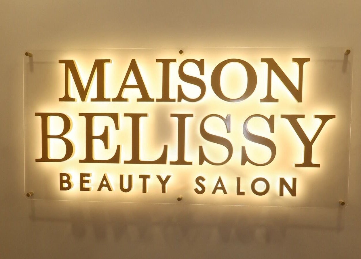 Illuminated Maison Belissy Beauty Salon sign in Toronto, Ontario, CA, highlighting luxury ambiance.