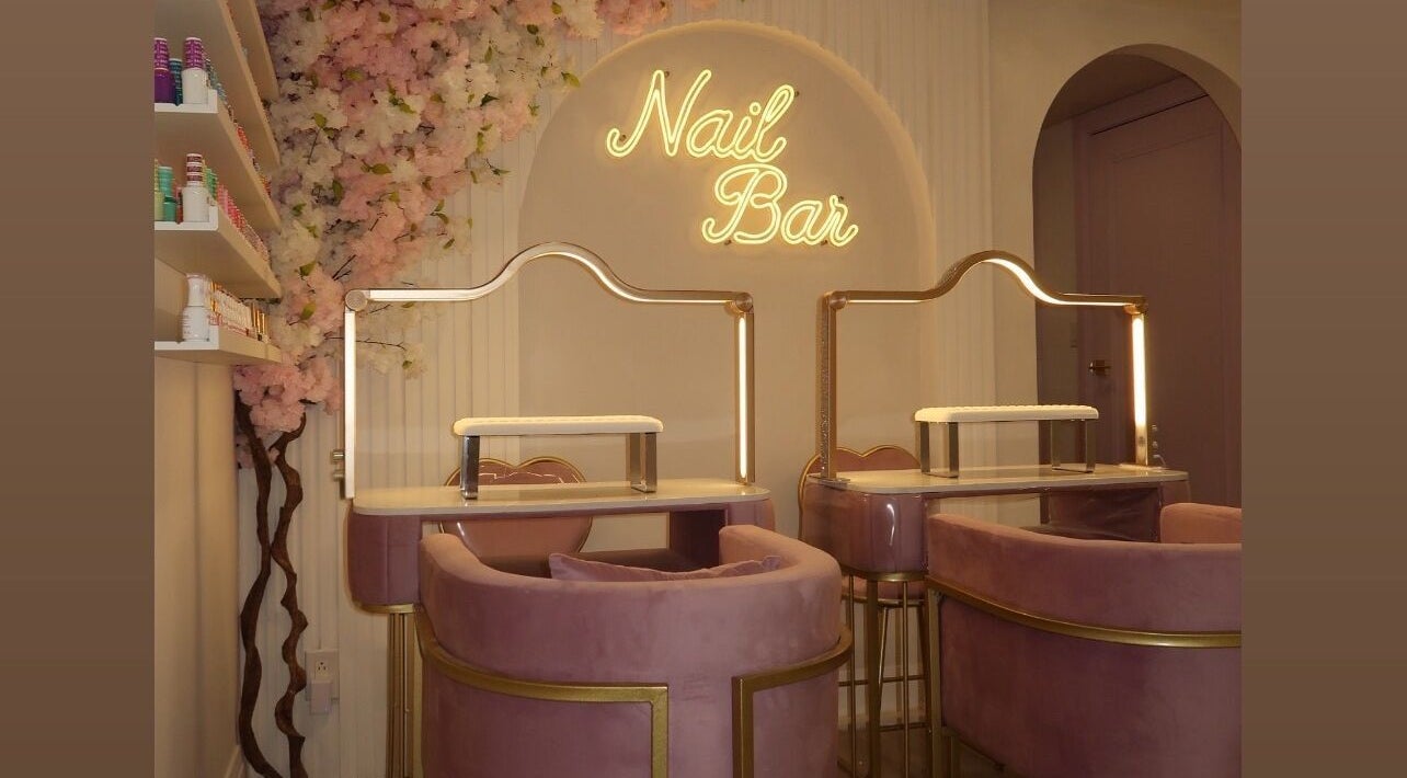 Luxurious nail bar setup at Maison Belissy Beauty Salon x Nail Salon, Toronto, Ontario, CA, with plush seating.