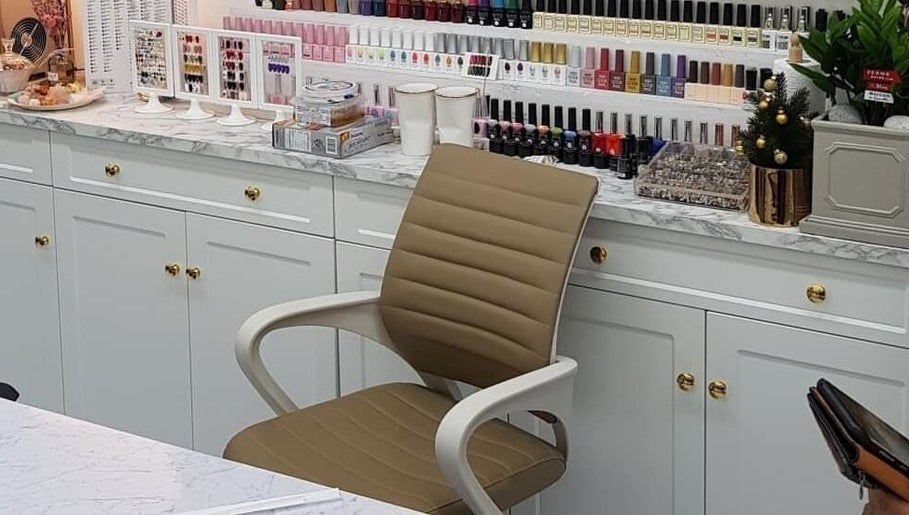 BuffNails nail polish collection display with cozy chair in Makkah, Makkah Province, SA.