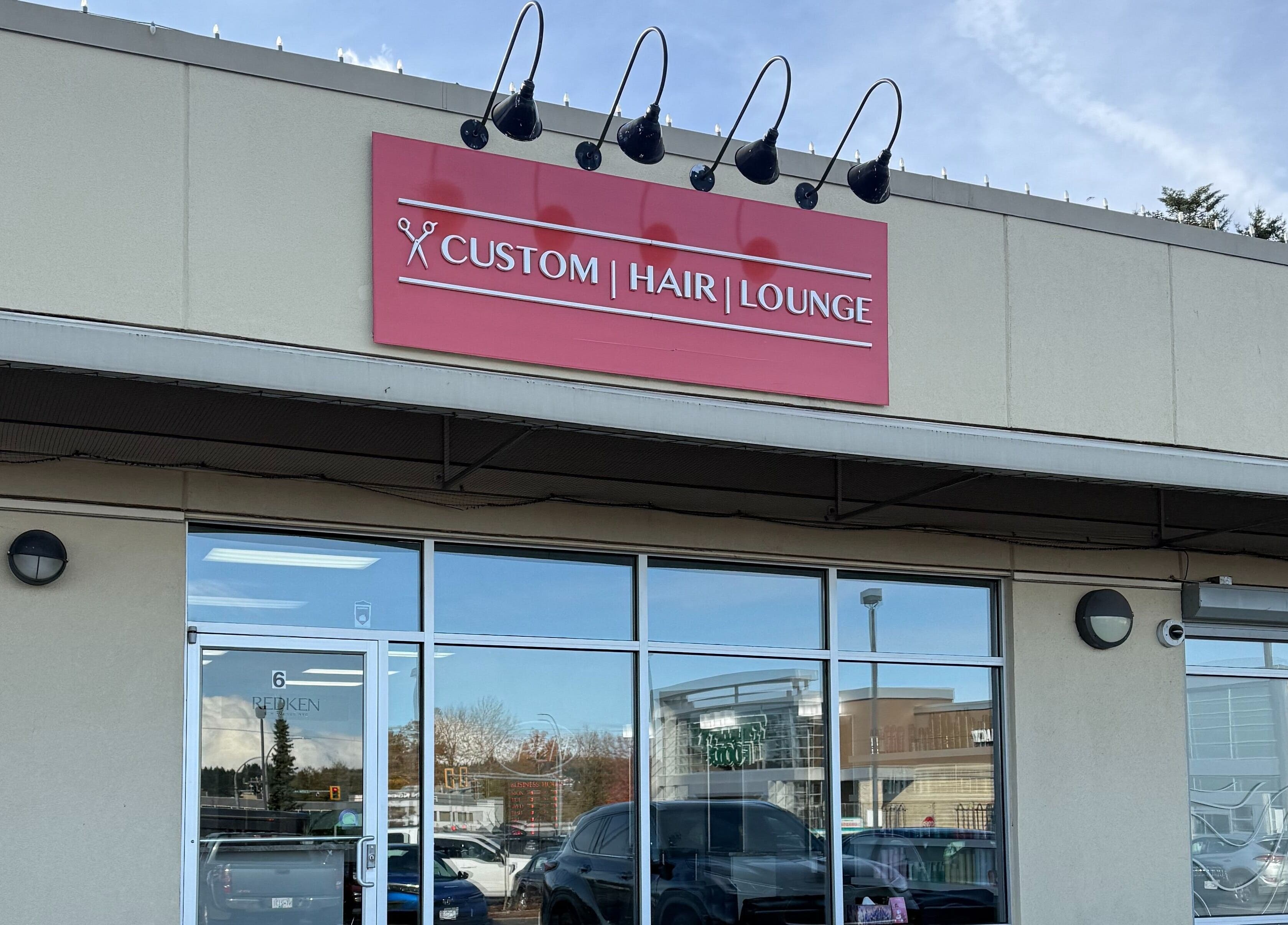 Custom Hair Lounge storefront in Courtenay, British Columbia, CA, featuring a modern exterior design.