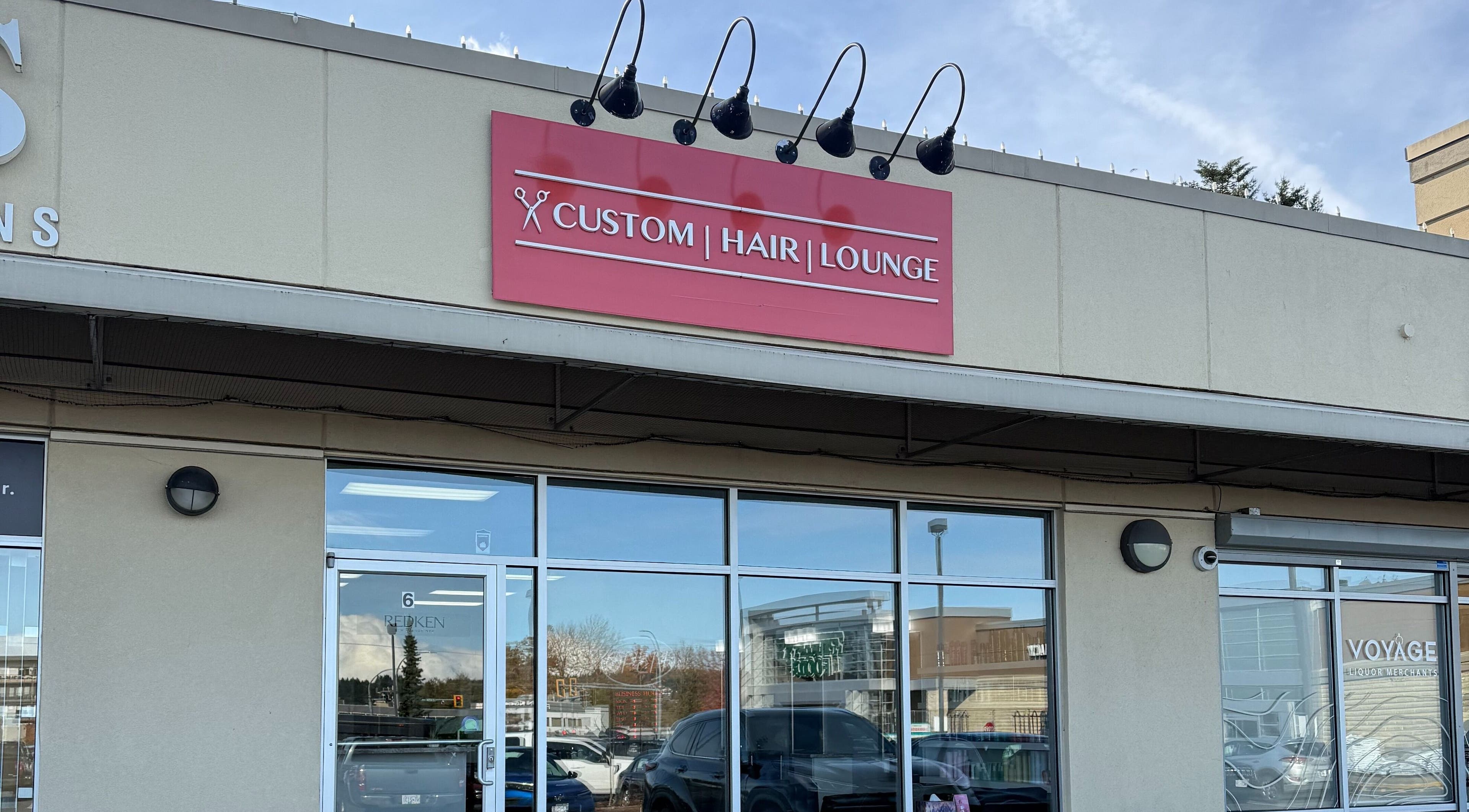 Custom Hair Lounge storefront in Courtenay, British Columbia, CA, featuring a modern exterior design.