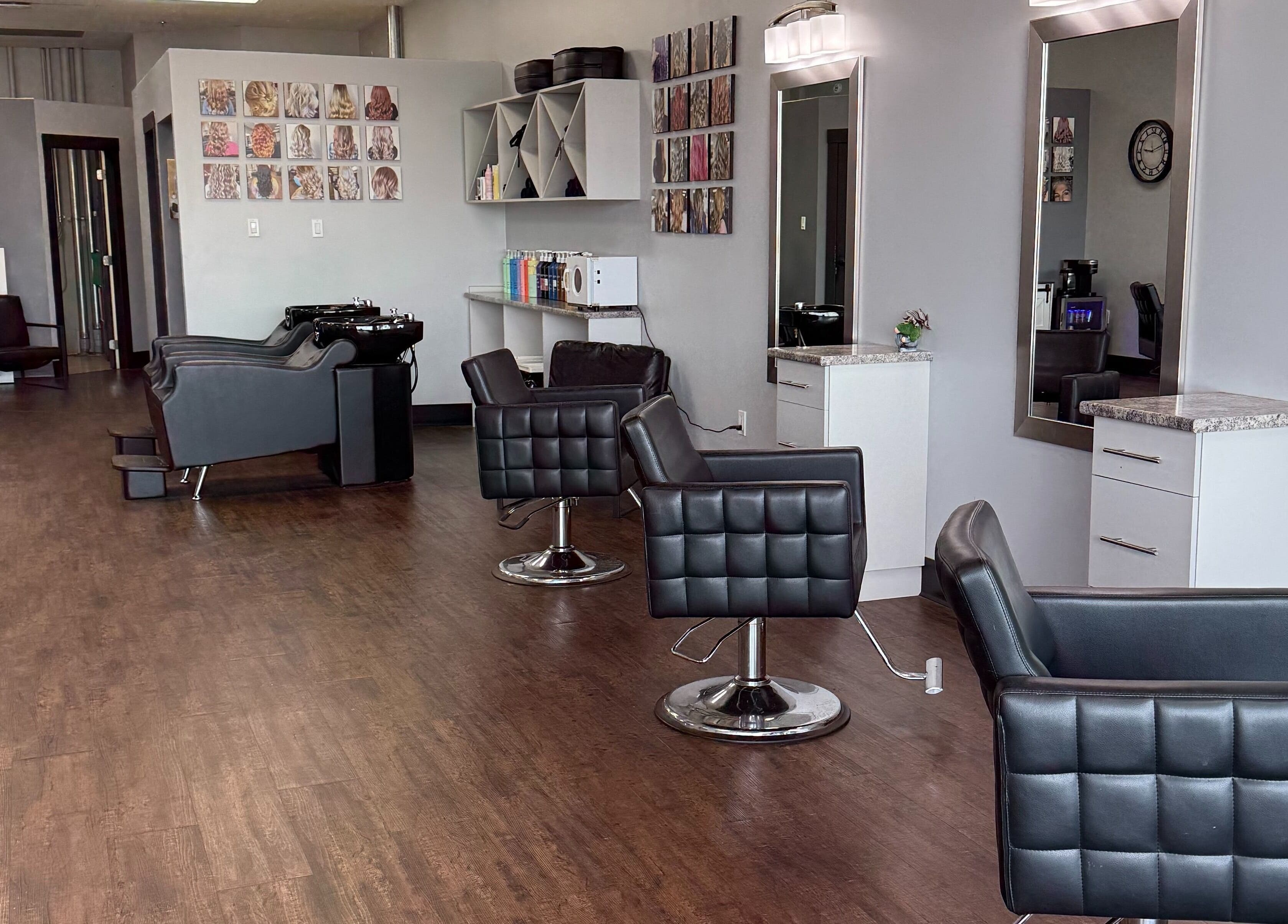 Interior of Custom Hair Lounge in Courtenay, BC, CA with modern styling chairs and decor.