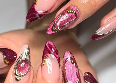 Elegant maroon and gold nail art at Polished Nail Bar DTLA, Los Angeles, California, US.