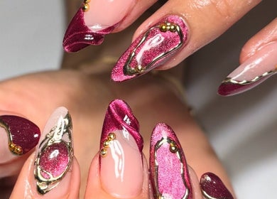 Elegant maroon and gold nail design at Polished Nail Bar DTLA, Los Angeles, California, US.