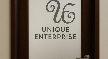 Unique Enterprise Nails entrance door logo in Atlanta, Georgia, US.