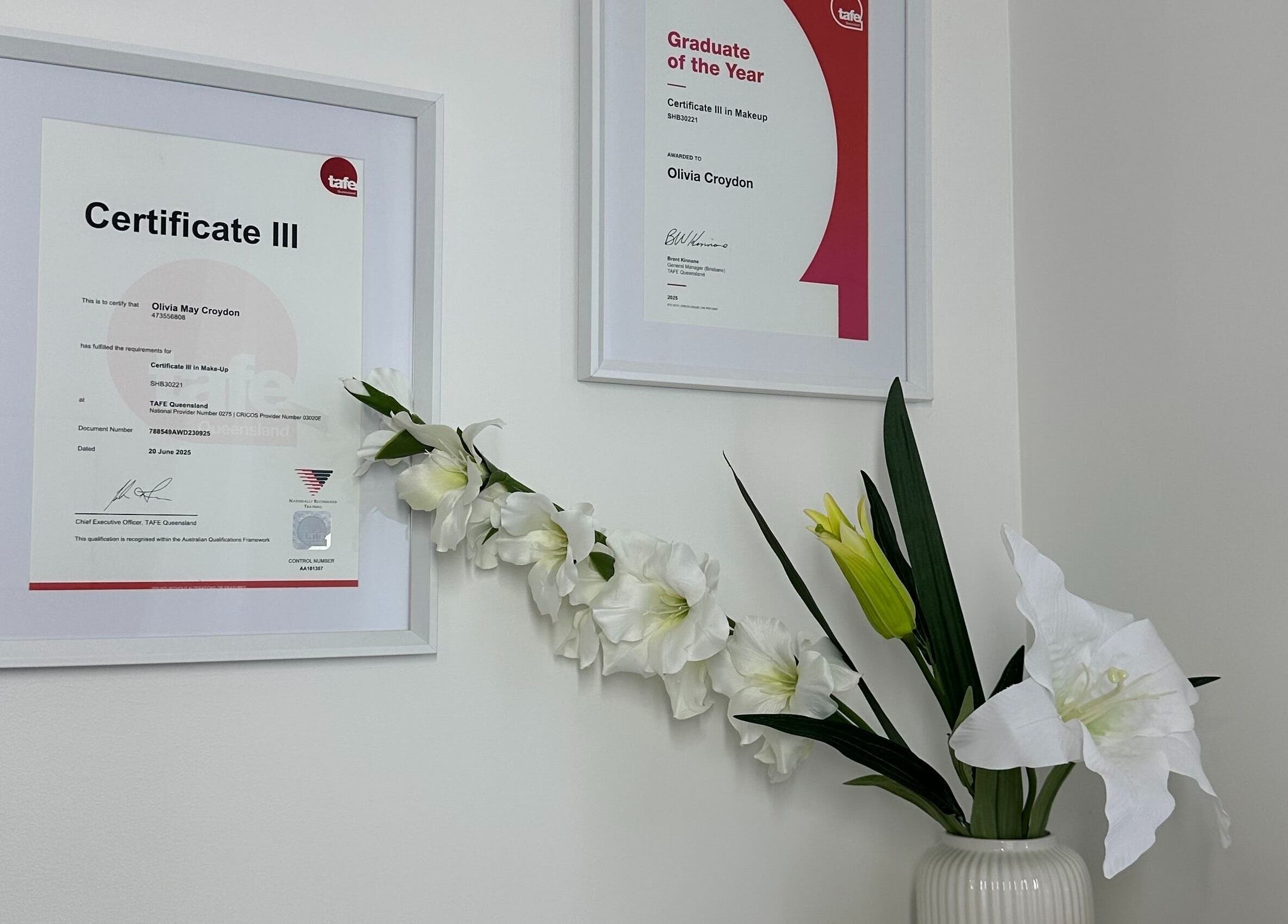Certificates and flowers at Alter Beauty in Harristown, Queensland, AU showcase elegance and professionalism.
