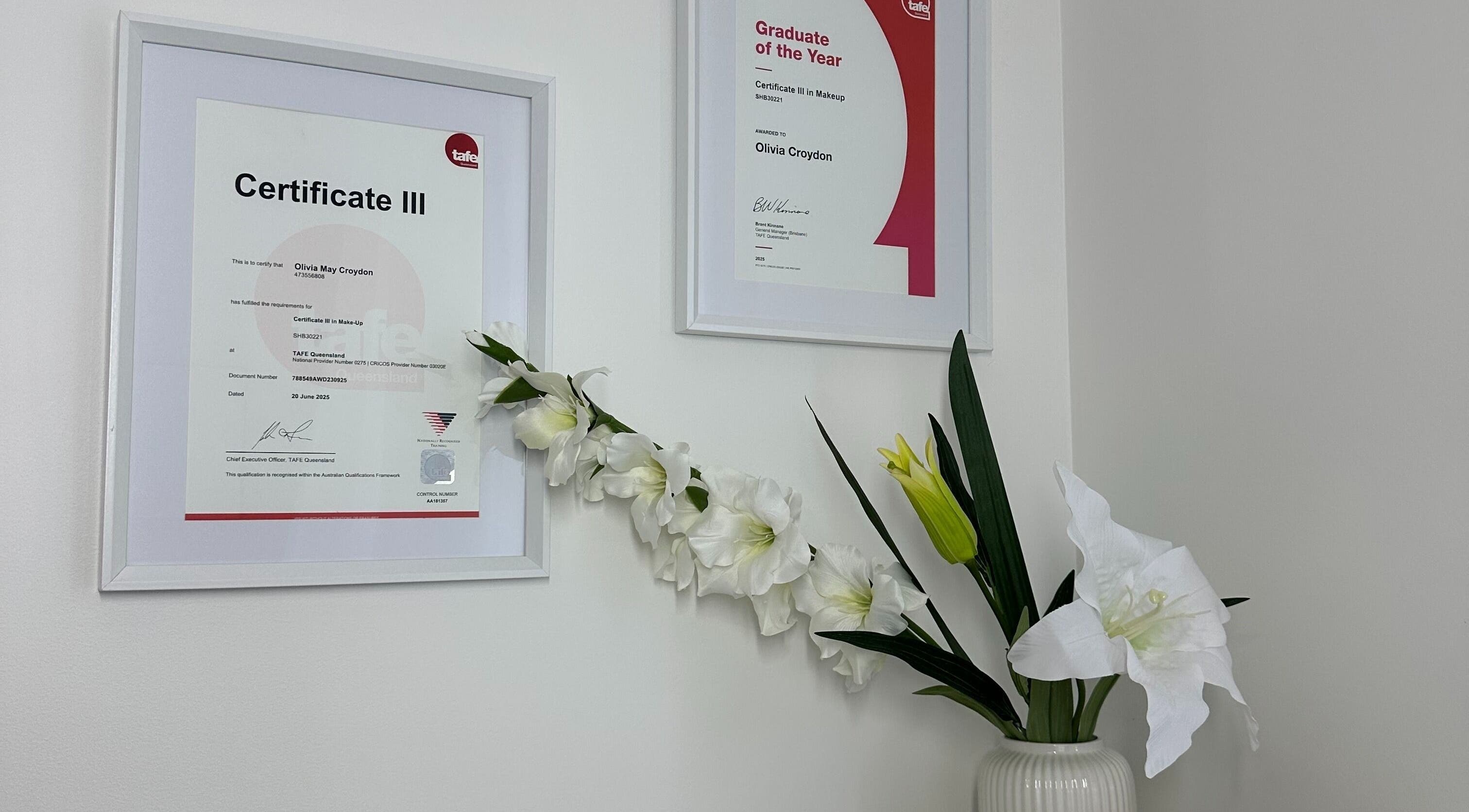 Certificates and flowers at Alter Beauty in Harristown, Queensland, AU showcase elegance and professionalism.