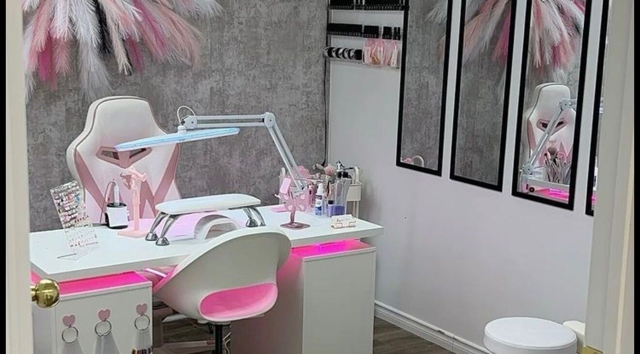 Elegant nail station at PinkPassion Nails in CW, featuring modern pink and white decor.