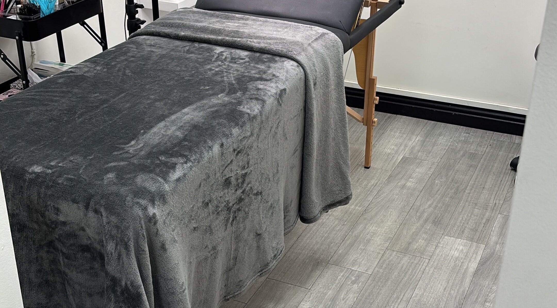 Relaxing massage bed at KW Beauty Lounge in Port of Spain, Port of Spain Corporation, TT, offering serene spa services.