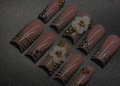 Intricate nail art featuring florals and gold accents at The Nail Fairy, El Dorado, Tunapuna/Piarco, TT.