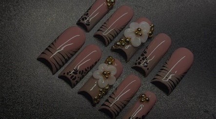 Intricate nail art featuring florals and gold accents at The Nail Fairy, El Dorado, Tunapuna/Piarco, TT.