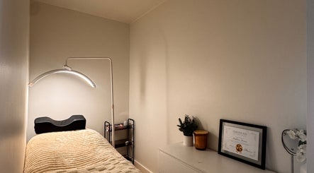 Calm treatment room at Md Lash and Beauty, Gerringong, New South Wales, AU with a therapy bed and soft lighting.