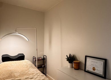 Relaxing treatment room at Md Lash and Beauty, Gerringong, New South Wales, AU with cozy bed and decor.