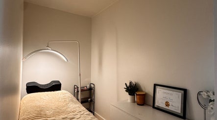 Relaxing treatment room at Md Lash and Beauty, Gerringong, New South Wales, AU with cozy bed and decor.