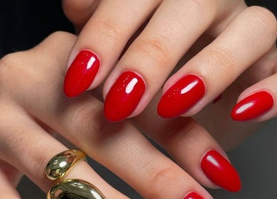 Vibrant red manicure at MAKOKI NAILS, Zapopan, Jalisco, MX showcasing exquisite nail artistry.