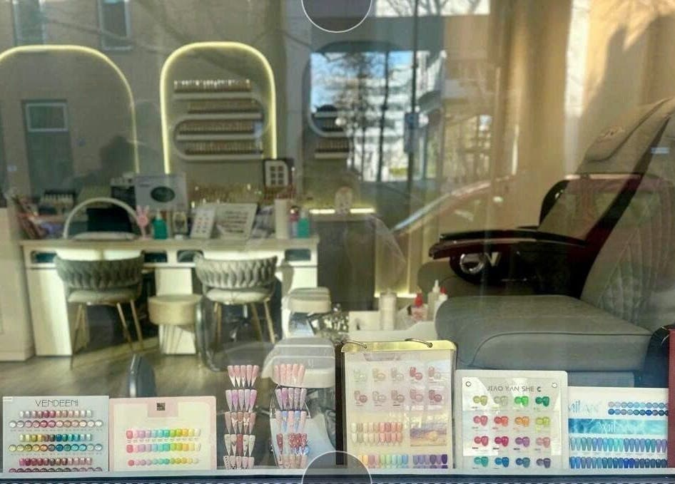 Nail sample display at Unique Nails München, München, Bayern, DE, showcasing vibrant options.